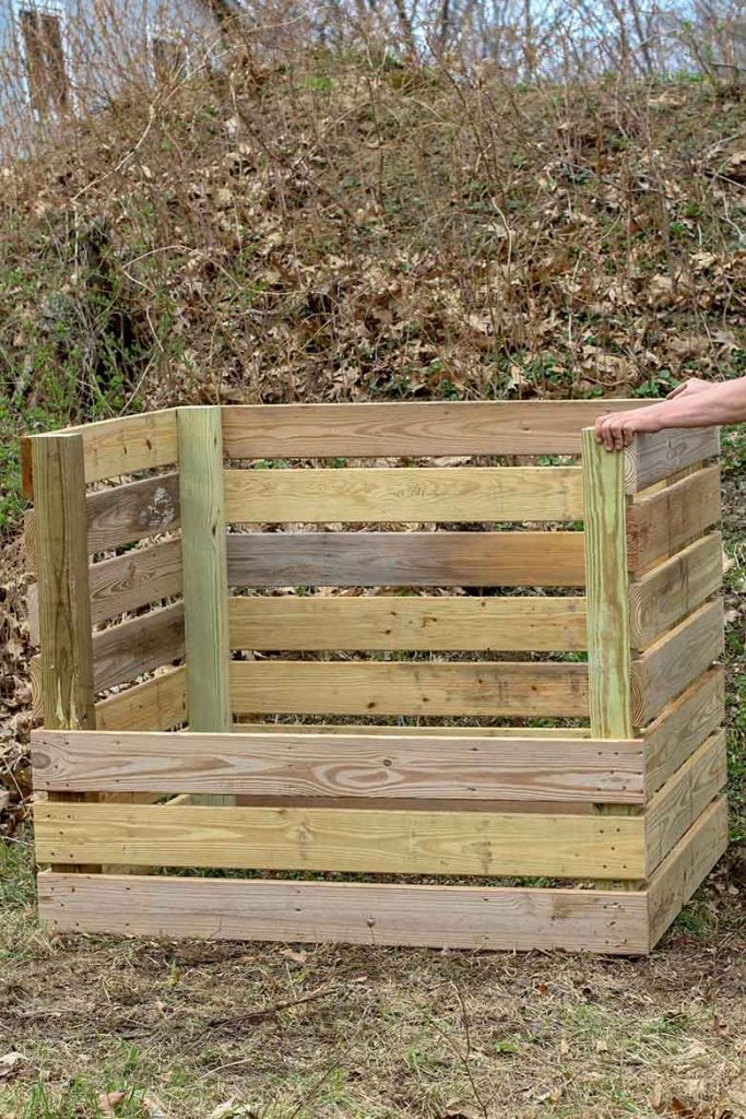 Completed compost bin being placed in the backyard