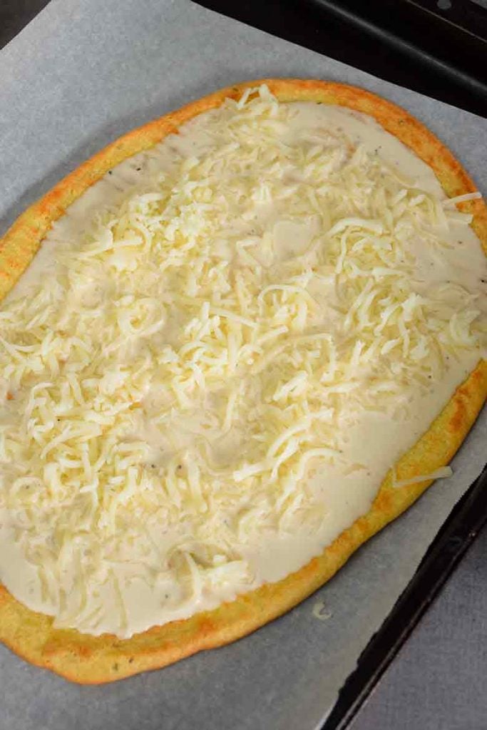 low carb pizza crust with cheese and alfredo sauce topping