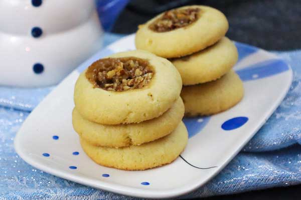 Pecan-Pie-Thumbprints Pecan Pie Thumbprints Cookies on a cookie plate